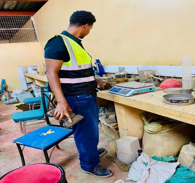 Abdiladif Saed Omar inspecting pavement-block research materials