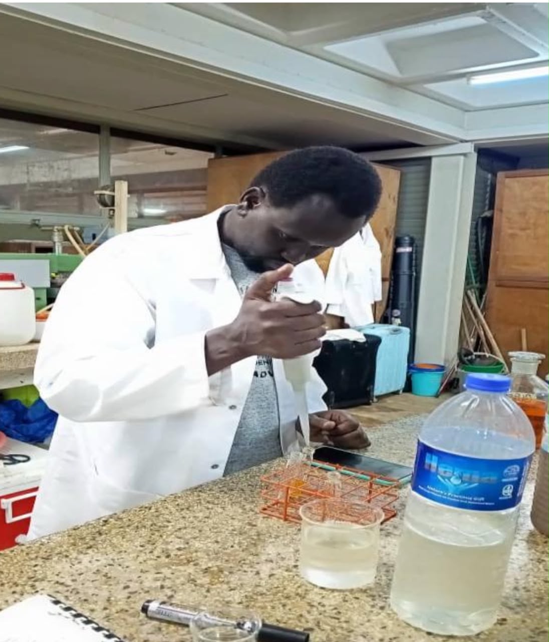 Water turbidity reduction using tamarind seed powder and hardwood ash
